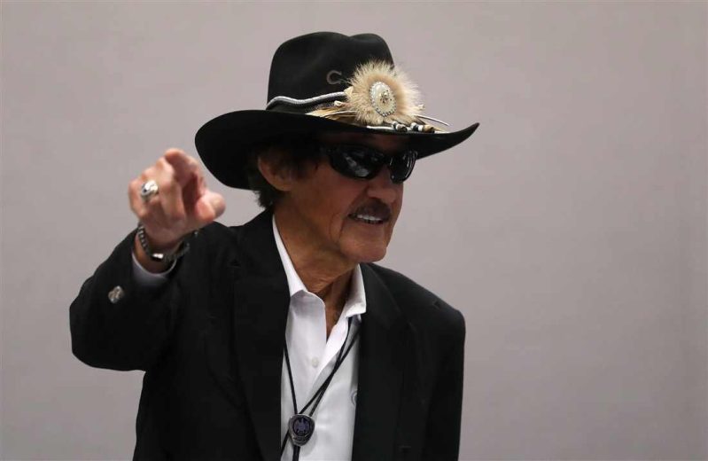 Richard Petty looks on.