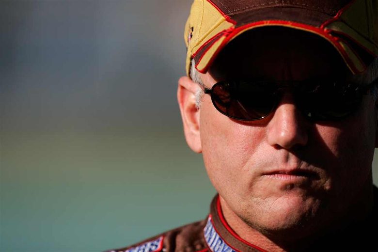 Ricky Rudd looks on.