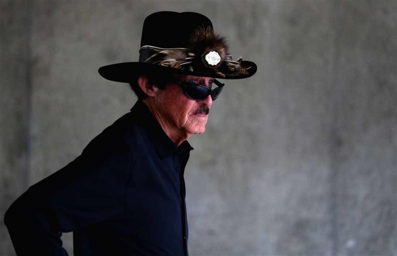 Richard Petty looks on.