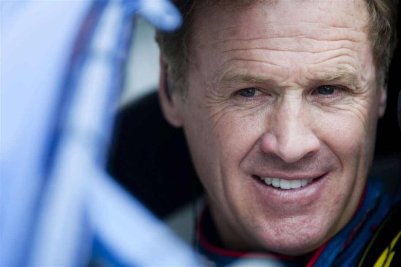 Rusty Wallace looks on.
