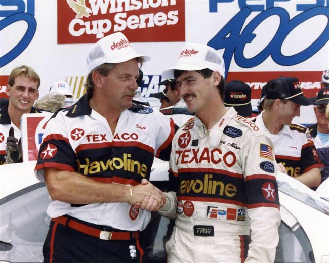 Davey Allison looks on.