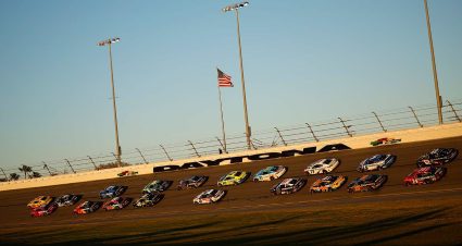 The Cup Series field rumbles through the high-banked turns at Daytona International Speedway.