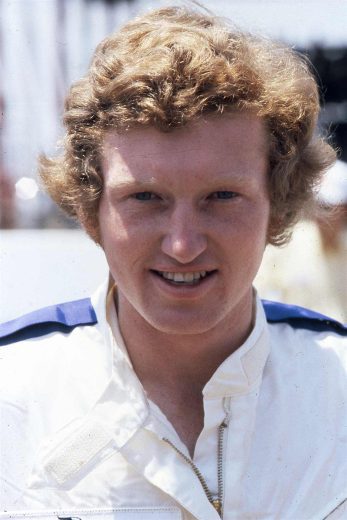 Bill Elliott looks on.