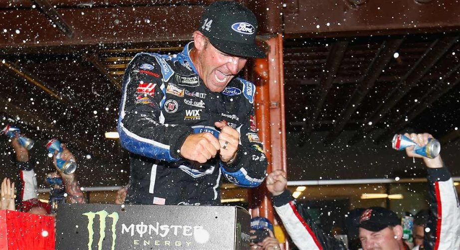 Clint Bowyer celebrates in Victory Lane at Michigan.