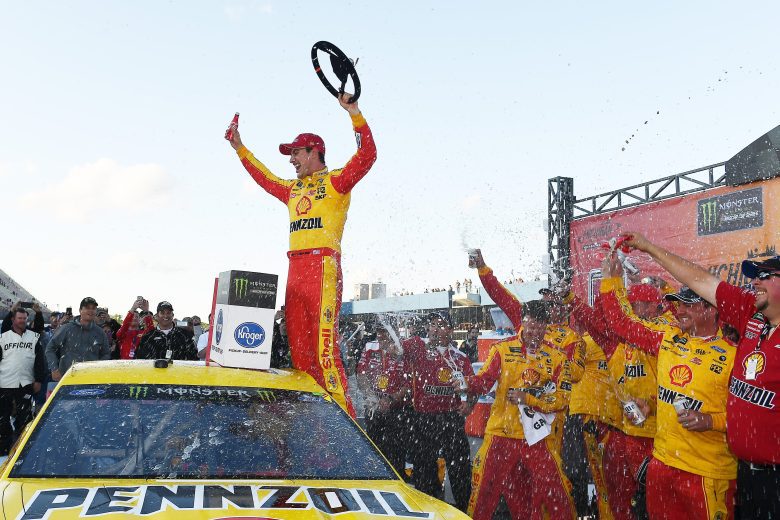 Joey Logano celebrates in Victory Lane at Michigan.