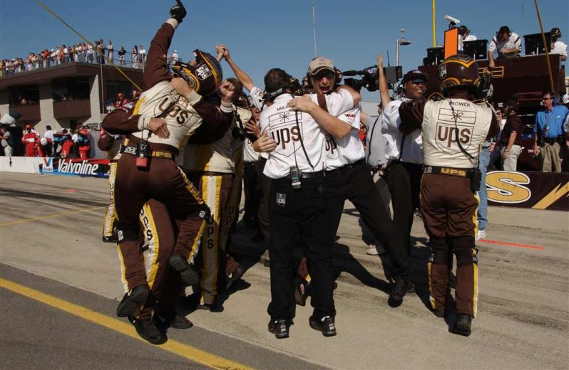 Dale Jarrett's team celebrates after winning at Michigan.