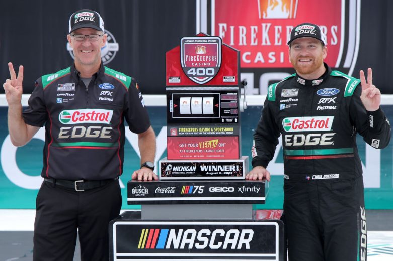 Chris Buescher celebrates in Victory Lane at Michigan.