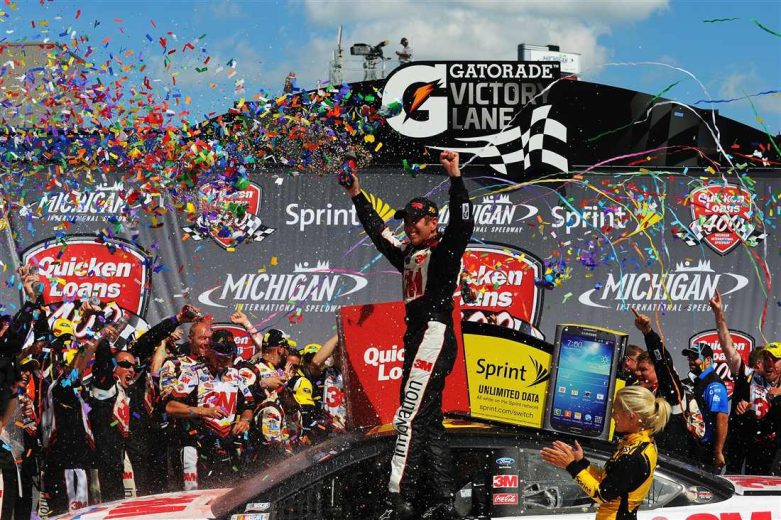 Greg Biffle celebrates in Victory Lane at Michigan.
