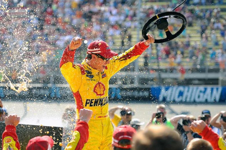 Joey Logano celebrates in Victory Lane at Michigan.
