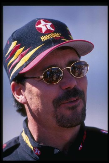 Ernie Irvan looks on.