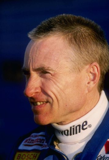 Mark Martin looks on.