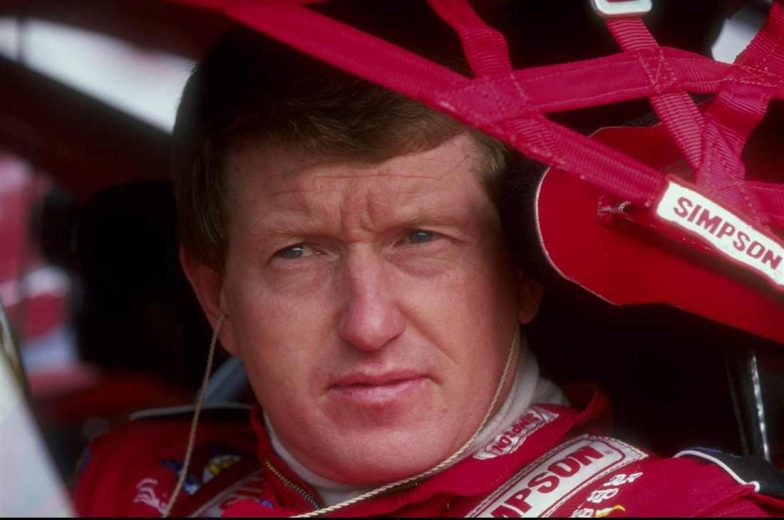 Bill Elliott looks on.