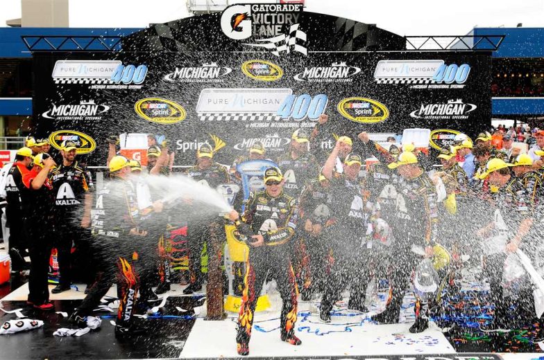 Jeff Gordon celebrates in Victory Lane at Michigan.