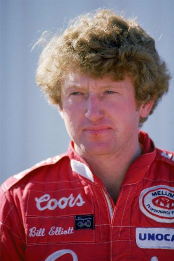 Bill Elliott looks on.