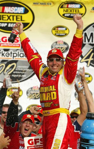 Greg Biffle celebrates in Victory Lane at Michigan.
