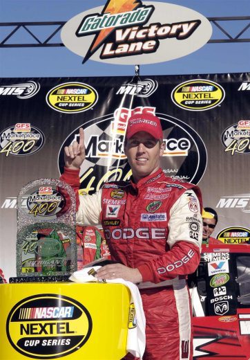 Jeremy Mayfield celebrates in Victory Lane at Michigan.