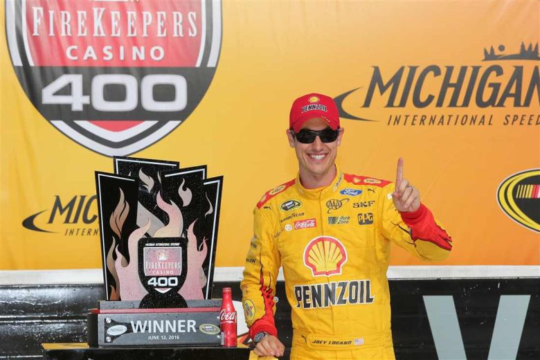Joey Logano celebrates in Victory Lane at Michigan.