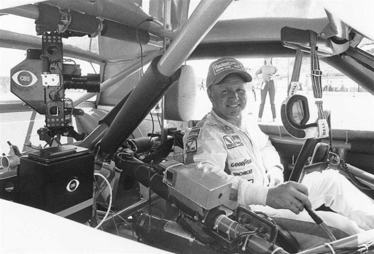 Cale Yarborough sits in his car.