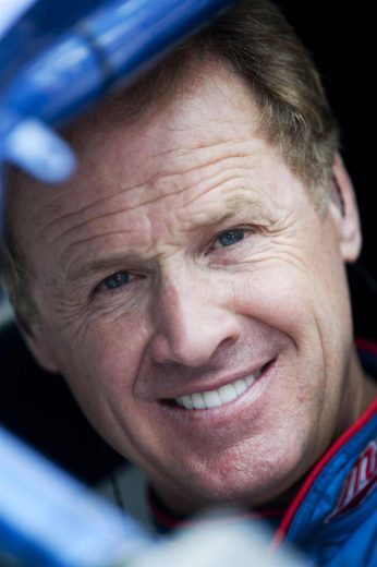 Rusty Wallace looks on.