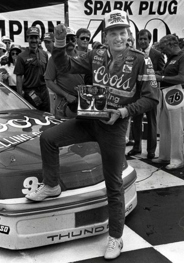 Bill Elliott looks on.