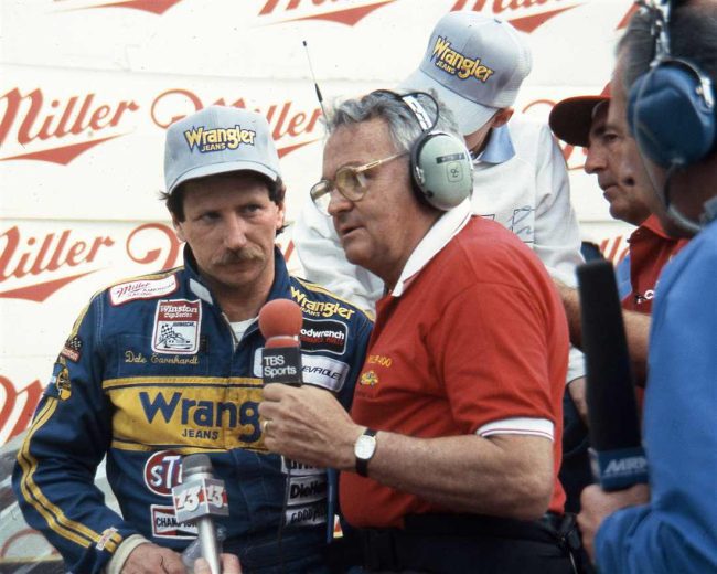 Dale Earnhardt stands in Victory Lane during an interview.