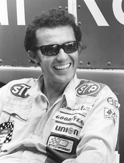 Richard Petty looks on.