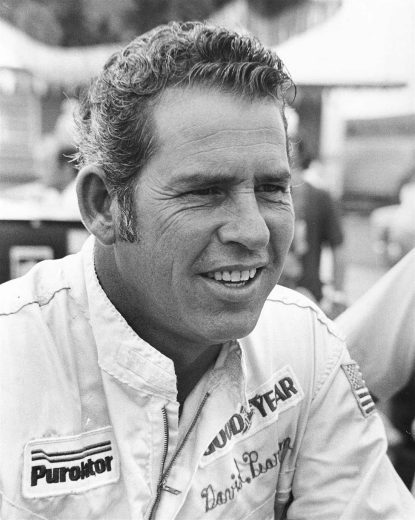 David Pearson looks on.