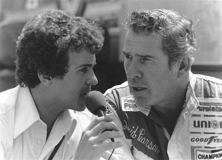 David Pearson looks on.