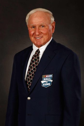 Cale Yarborough looks on.