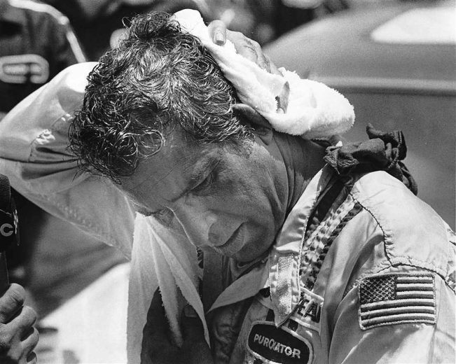 David Pearson looks on.