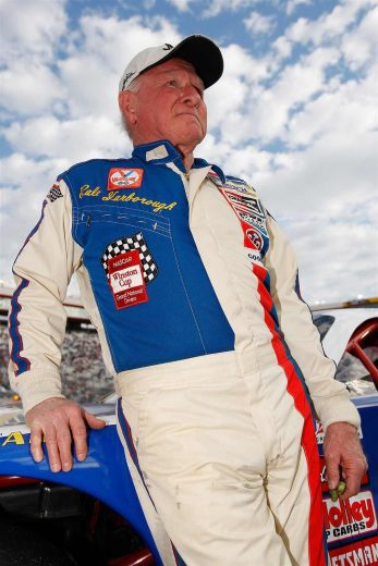 Cale Yarborough looks on.