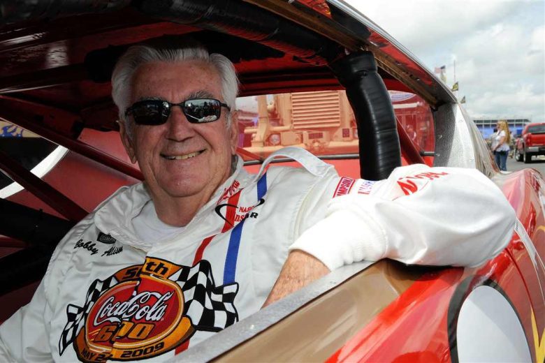 Bobby Allison sits in his car.