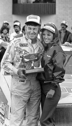 Bobby Allison celebrates in Victory Lane at Michigan.