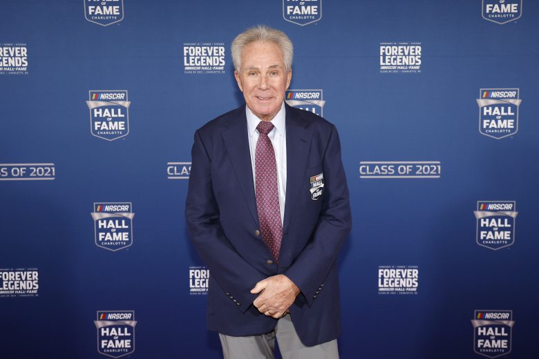 Darrell Waltrip standing during Hall of Fame induction.