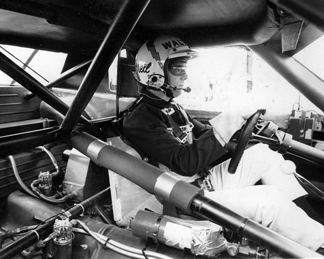 Darrell Waltrip drives car.
