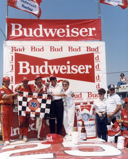 Tim Richmond holds trophy in Victory Lane.