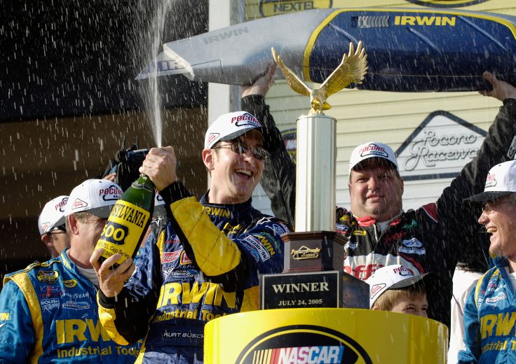 Kurt Busch sprays champagne.