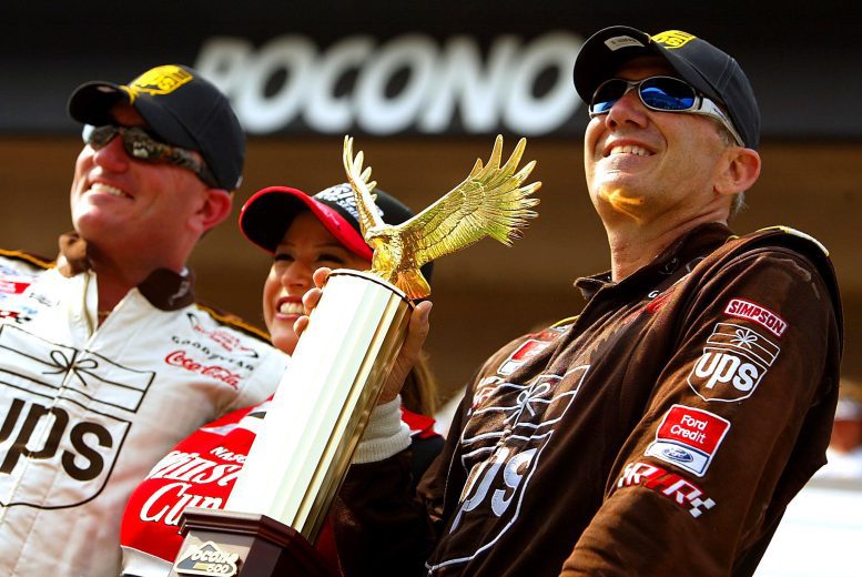 Dale Jarrett holds up trophy in Pocono Victory Lane.
