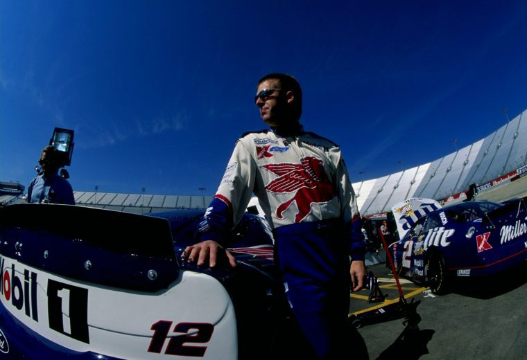 Jeremy Mayfield stands next to car.