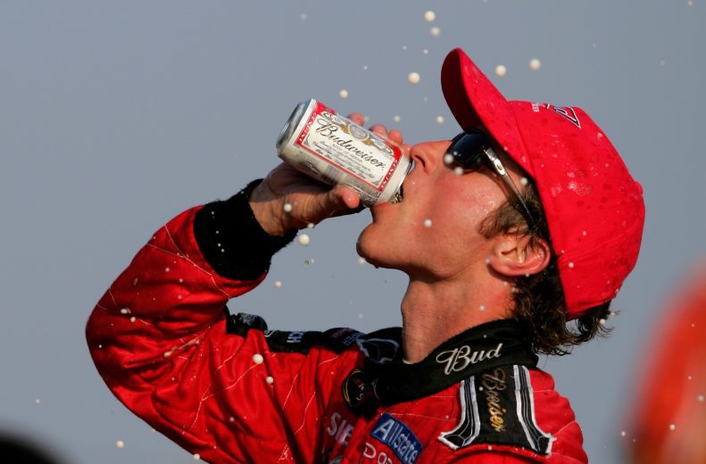 Kasey Kahne drinks beer in Pocono Victory Lane.
