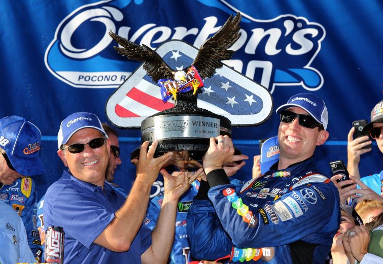 Kyle Busch celebrates in Pocono Victory Lane.