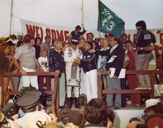 Richard Petty stands in Victory Lane at Pocono.