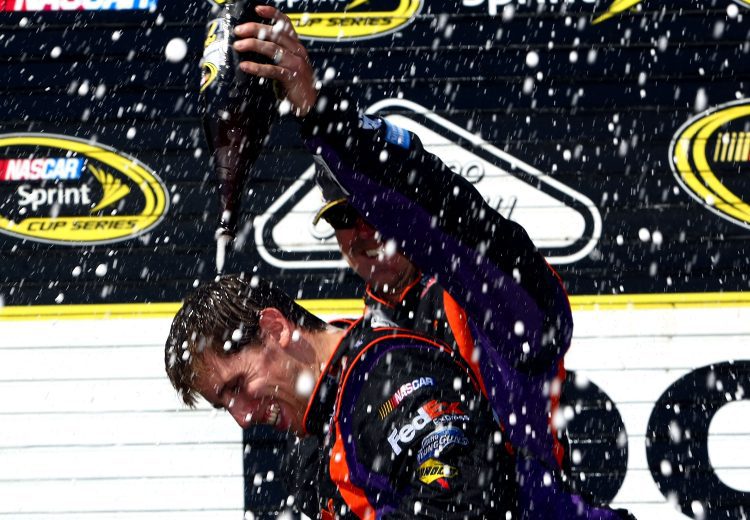 Denny Hamlin celebrates in Pocono Victory Lane.