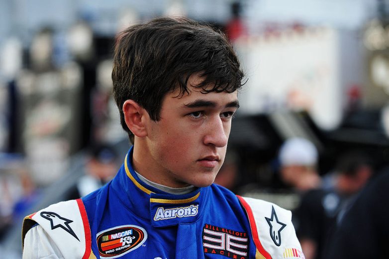 Chase Elliott looks on.