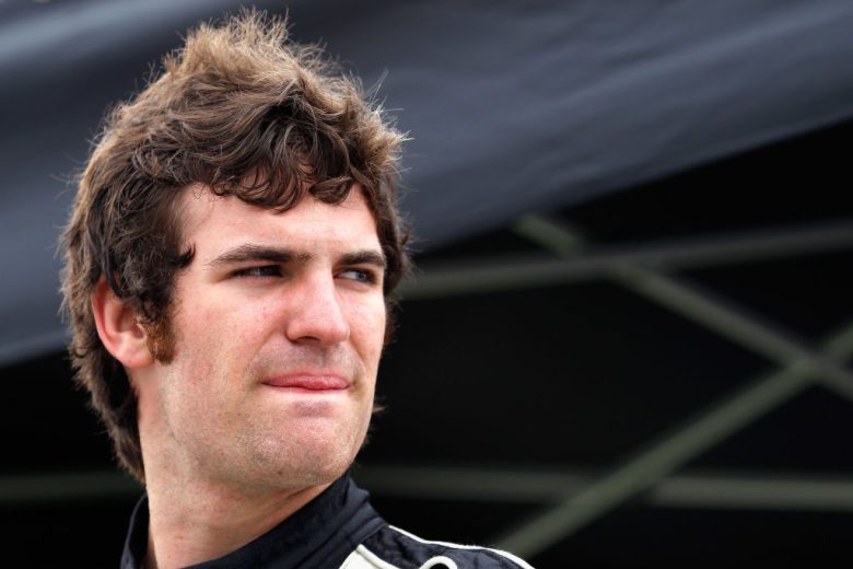 Corey LaJoie looks on.