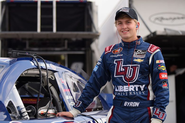 William Byron looks on.