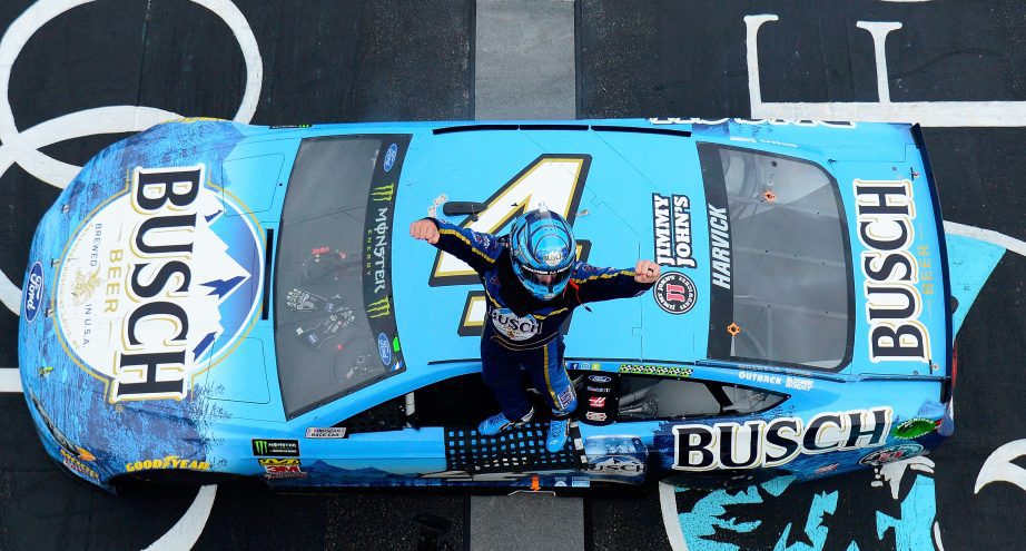 Kevin Harick celebrates win on top of No. 4 Ford.