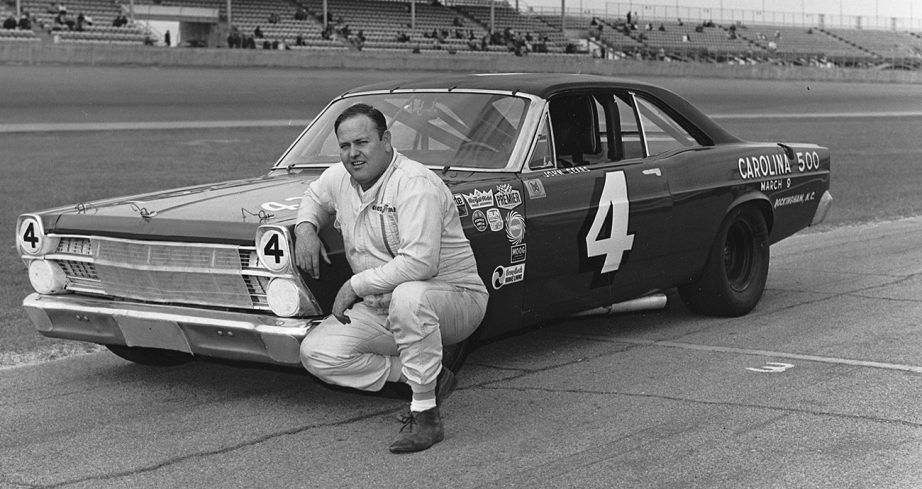 Big John Sears poses next to No. 4 car at Daytona.