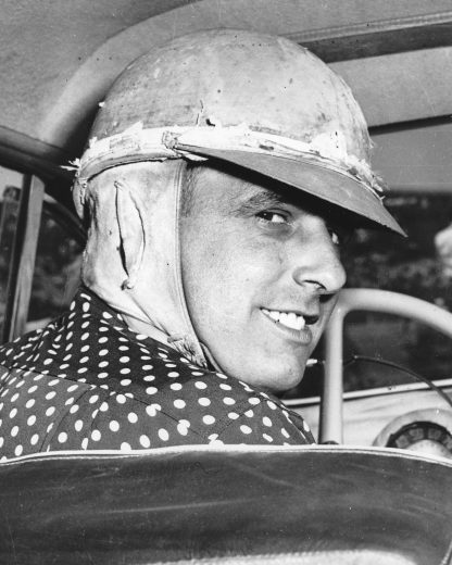 John Soares smiles and looks on from driver seat of No. 4.