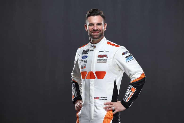 Corey LaJoie looks on.
